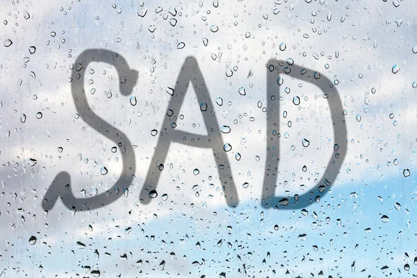 Sad Written Finger Misted Glass Window Glass Raindrops Blue Sky — Stock Photo, Image