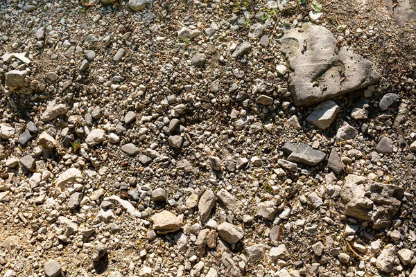 石质土壤的质感 一个大小不一的石头碎片的背景图像 — 图库照片