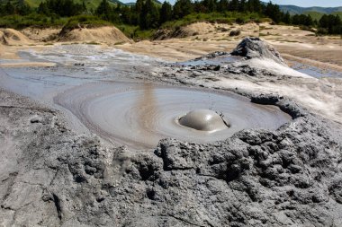 Mud geyser or mud volcano. Geological formation. particular hydrogeological conditions Generally all geyser field sites are located near active volcanic areas clipart