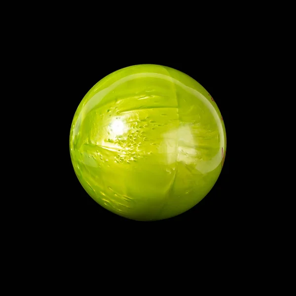 Bowling ball light green. Isolated on a black background close-up.