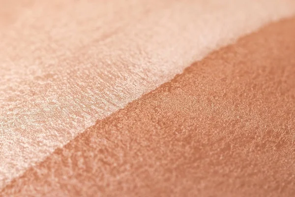 Skin tone powder, macro image of cosmetics, two-tone bronzer and highlighter