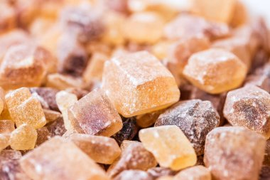 Cane sugar in crystal cubes, fragrant brown sugar for tea and coffee clipart