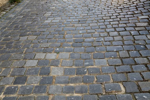 stock image old cobbled surface of the road