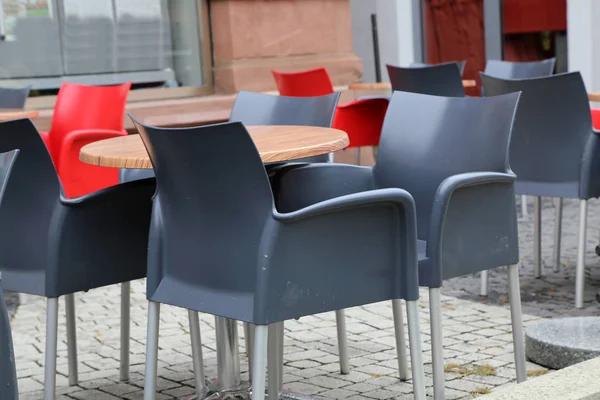 Cozy street restaurant. Tables and chairs in the street.