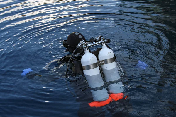 Diver plunges into the dark water deep lake — Stock Image Diver plunges into the dark water deep lake Royalty Free Stock Photos