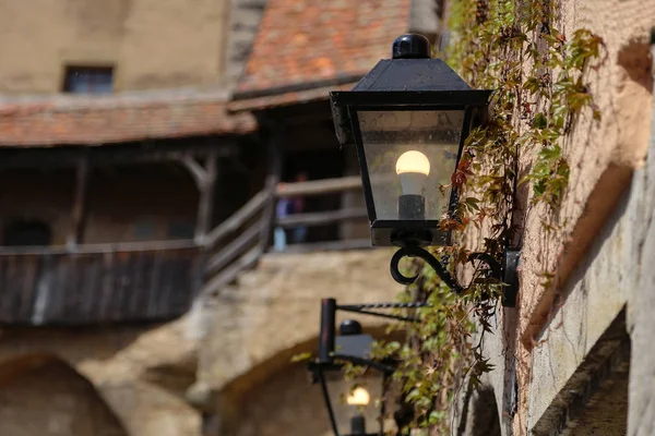 Old street lamps illuminate the way for passersby — Stock Photo, Image