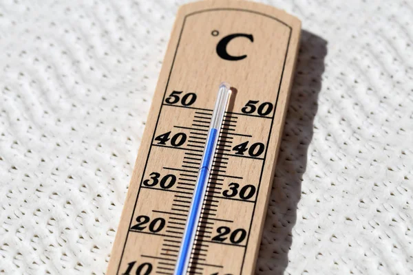 Thermometer shows high temperatures of hot summer