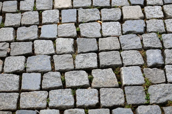 石畳の質感 花崗岩の石畳の背景石 古い石畳の舗装の閉鎖の概要背景 — ストック写真