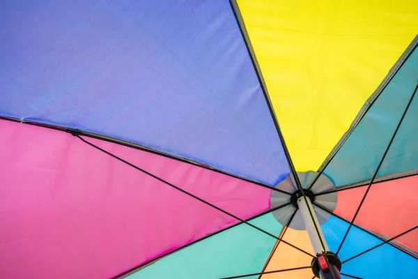 Angle view of colorful umbrella under sunshine, summer season — Stock Photo, Image