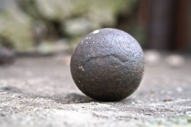 Ancient core for cannons and bullets. Antique historical artifact from the Middle Ages. clipart