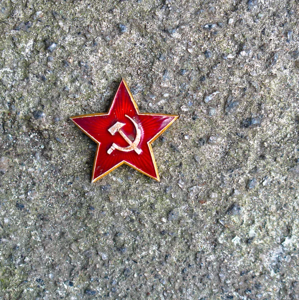 Red Star with the coat of arms of the Soviet Union. Congratulations on February 23, the day of the Soviet and Russian army. Concrete and grunge background