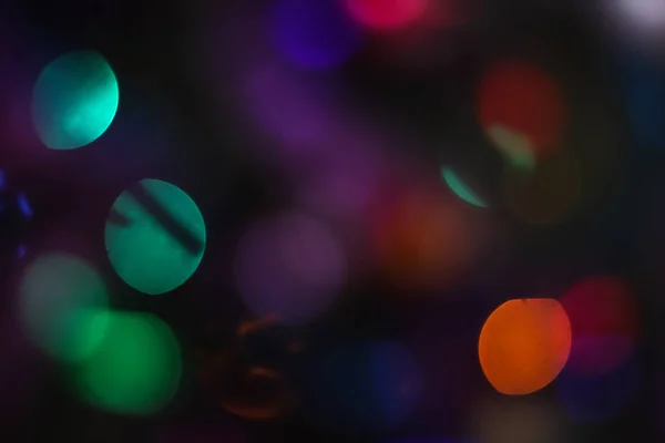 Fundo de Natal bonito com guirlandas e bokeh. Ano Novo imagem multi-colorida. Imagem de foto abstrata para design — Fotografia de Stock