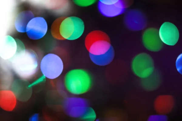 Beautiful Christmas background with garlands and bokeh. New year  multi-colored picture. Abstract photo image for design — ストック写真