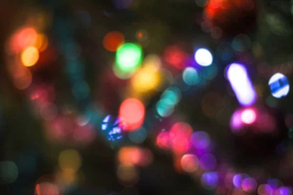 Beautiful Christmas background with garlands and bokeh. New year  multi-colored picture. Abstract photo image for design — ストック写真