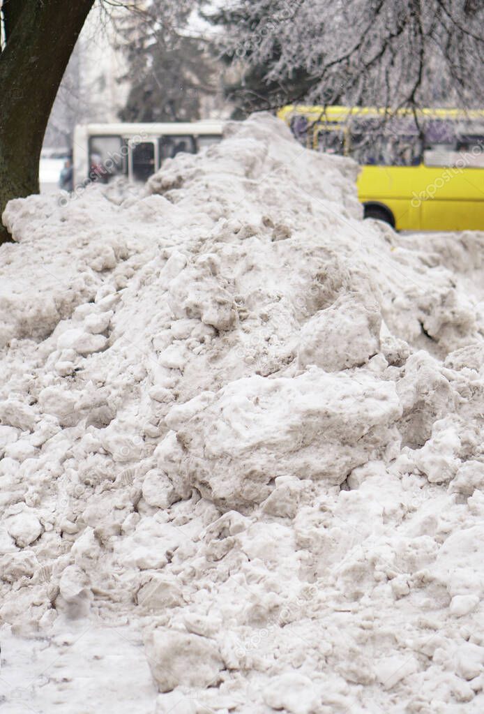 Big abnormal snowfall in the city. Street cleaning and snowdrifts. Snow and collapse of communal services. Stock photo for demonstration