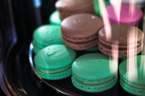 Delicious sweets in a shop window. Beautiful cookies for sale. Stock background