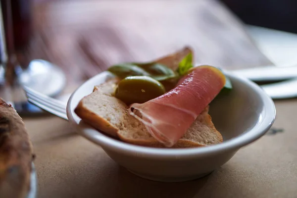 Food in the restaurant, wine, meat, salads, stewed vegetables. Stock photo