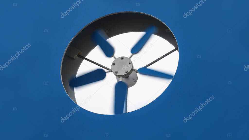 Blue ventilation screw is spinning to ventilate the room. Stock photo background