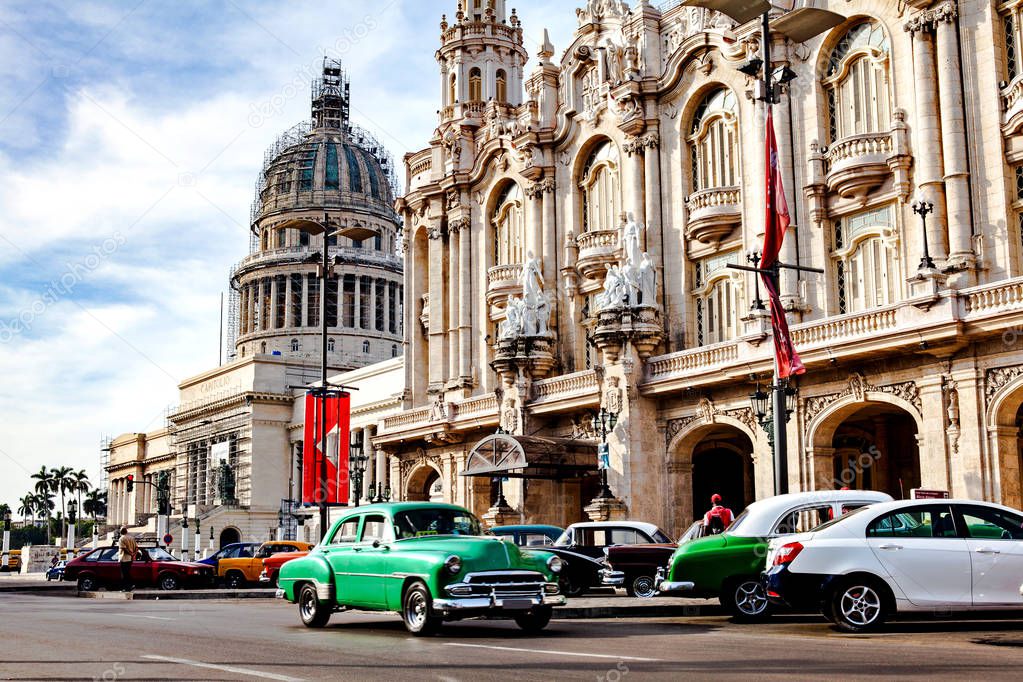 Havana, Cuba - December 12, 2016: Traffic in front of the Capitol and the National Theatre (Alicia Alonso) near the Central Park