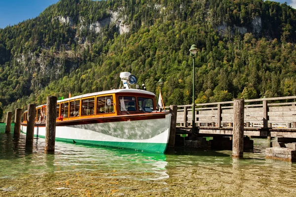 Electric tourist boats on beautiful lake Konigssee pier Berchtes