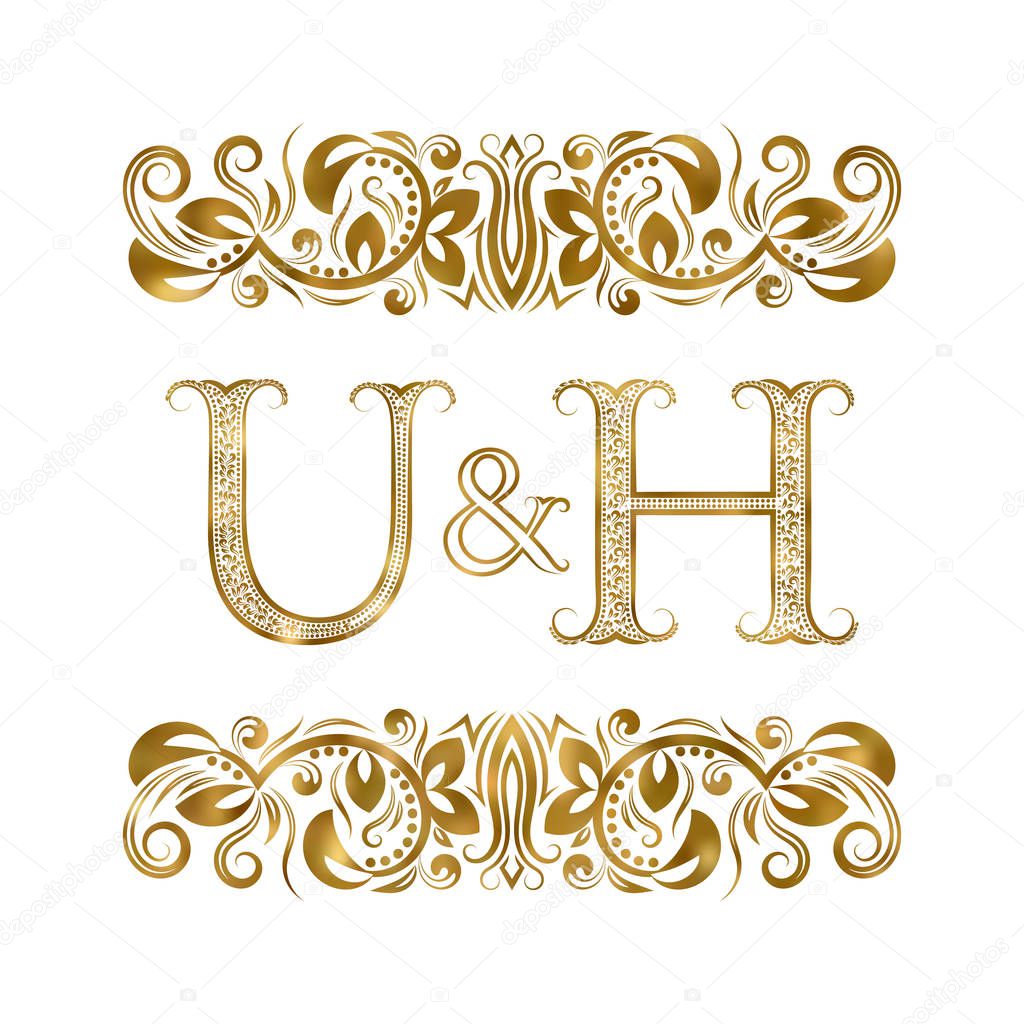 U and H vintage initials logo symbol. The letters are surrounded by ornamental elements. Wedding or business partners monogram in royal style.