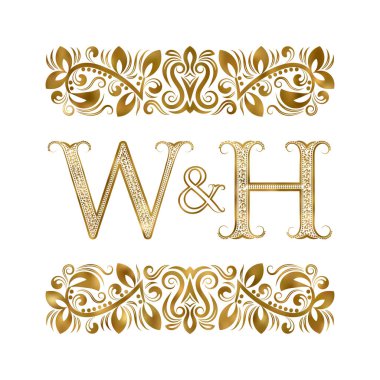 W ve H vintage baş harfleri logo sembolü. Harfleri süs öğeleri tarafından çevrili. Düğün ya da iş ortakları monogram kraliyet tarzı.