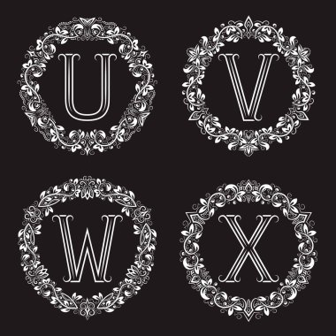 Yuvarlak çelenkli klasik monogram seti. Çiçek çerçeveli U, V, W, X beyaz harfleri.