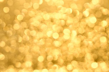 Soyut bulanık vurgular ile altın sarısı arka plan. Bokeh bulanıklık içinde.