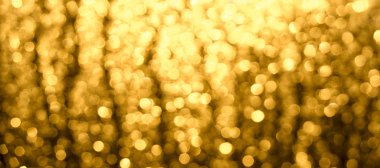 Soyut Noel bulanık arka plan. Bokeh'in altın-kahverengi parıltısı.
