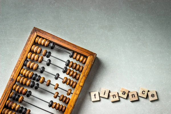 Old wooden scratched vintage decimal abacus on concrete background. Top view. Mock up. Copy space — Stock Photo, Image