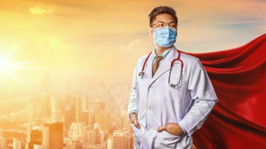 Tıbbi maske takan doktor. Tıbbın süper kahraman gücü. Corona Virüsü Covid 1