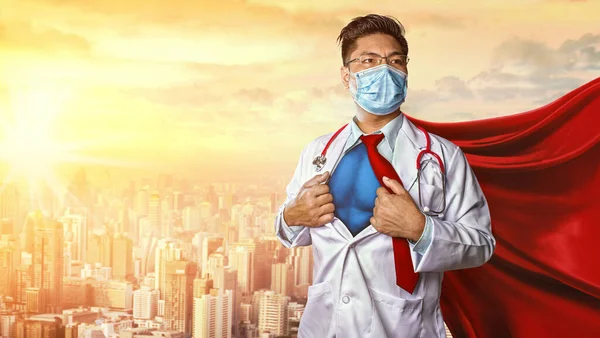 Tıbbi maske takan doktor. Tıbbın süper kahraman gücü. Corona Virüsü Covid 1