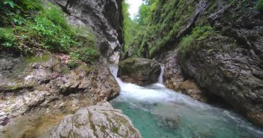 Alpine stream with canyon and turquoise water