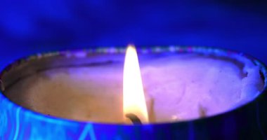 Macro - Candle flame burning in the night