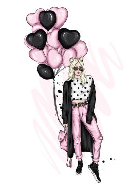 Şık ceketli, atkılı, kot pantolonlu ve botlu güzel bir kız. Şık kıyafetler, aksesuarlar, moda ve tarz. Kalp şeklinde balonlar. Sevgililer Günü.