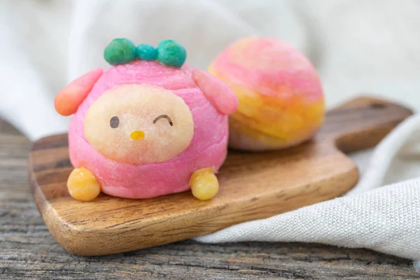 Cute Chinese Pastry or moon cake stuffed with salted egg yolk on