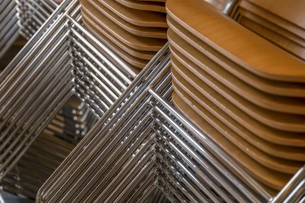 Stacked Chairs Wooden Seats Metallic Legs — Stock Photo, Image