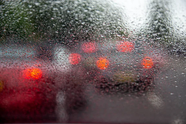 Driving with heavy rain on car windscreen