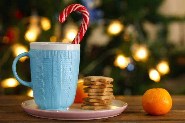 Blue Mug Christmas Candy Tangerines Ginger Cookies Background Christmas Lights — Stock Photo, Image