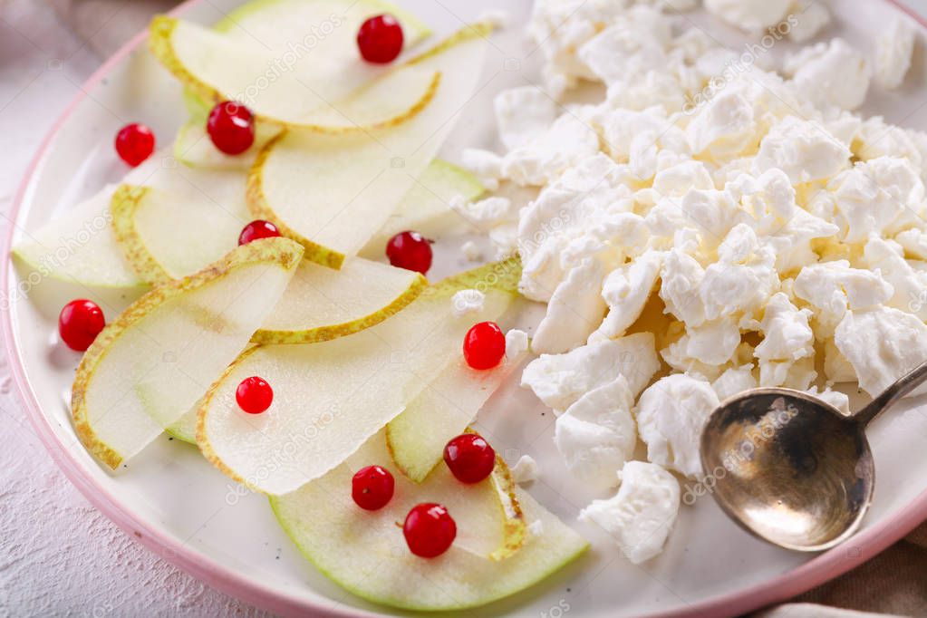 Breakfast with coffee. cottage cheese with slices of pear, Apple and cranberries