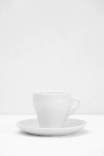 One white empty Cup on a white background — Stock Photo, Image