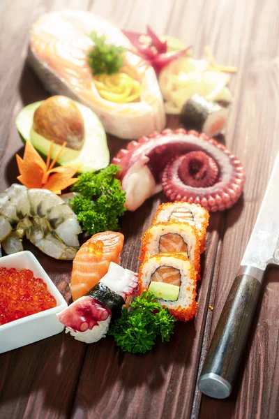 Sushi Set. Different sashimi, sushi and rolls with octopus — Stock Photo, Image