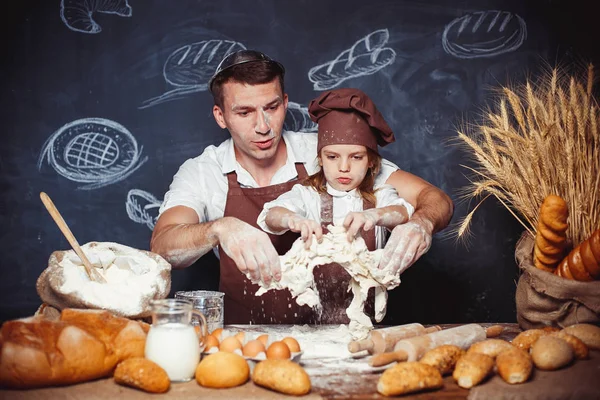 Playful man with daughter making bread — Stock Photo, Image