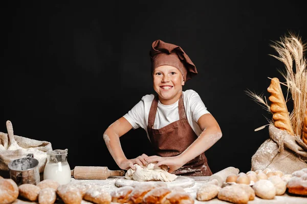 Cute boy with chef hat cooking — Stock Photo, Image