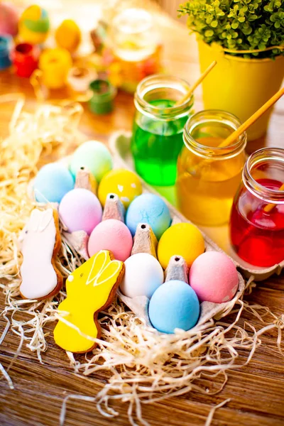 Happy Easter. Background with colorful eggs in basket. Table decorating for holiday. Top view. — Stock Photo, Image