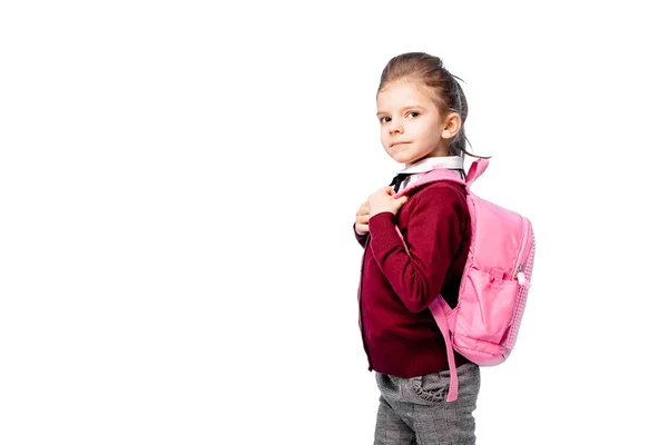 Niño con mochila. Chica en camisa blanca y pantalones grises, sostenga una bolsa de la escuela y posando como modelo. Aislado sobre blanco — Foto de Stock