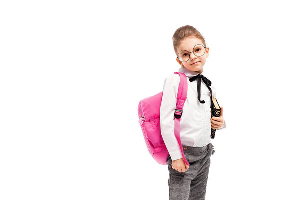 Child with schoolbag. Girl with pink school bag isolated on whit
