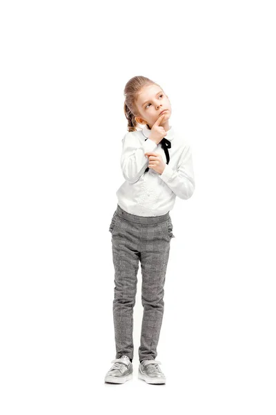 Menina bonita em camisa branca e calças cinza em pé nea — Fotografia de Stock