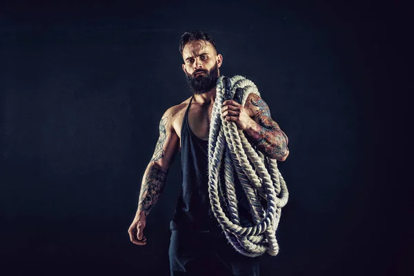 Men holding battle rope, functional training