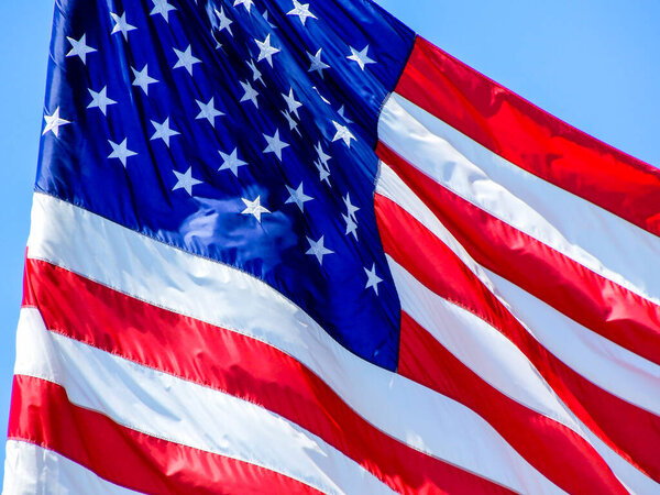 American flag on blue sky